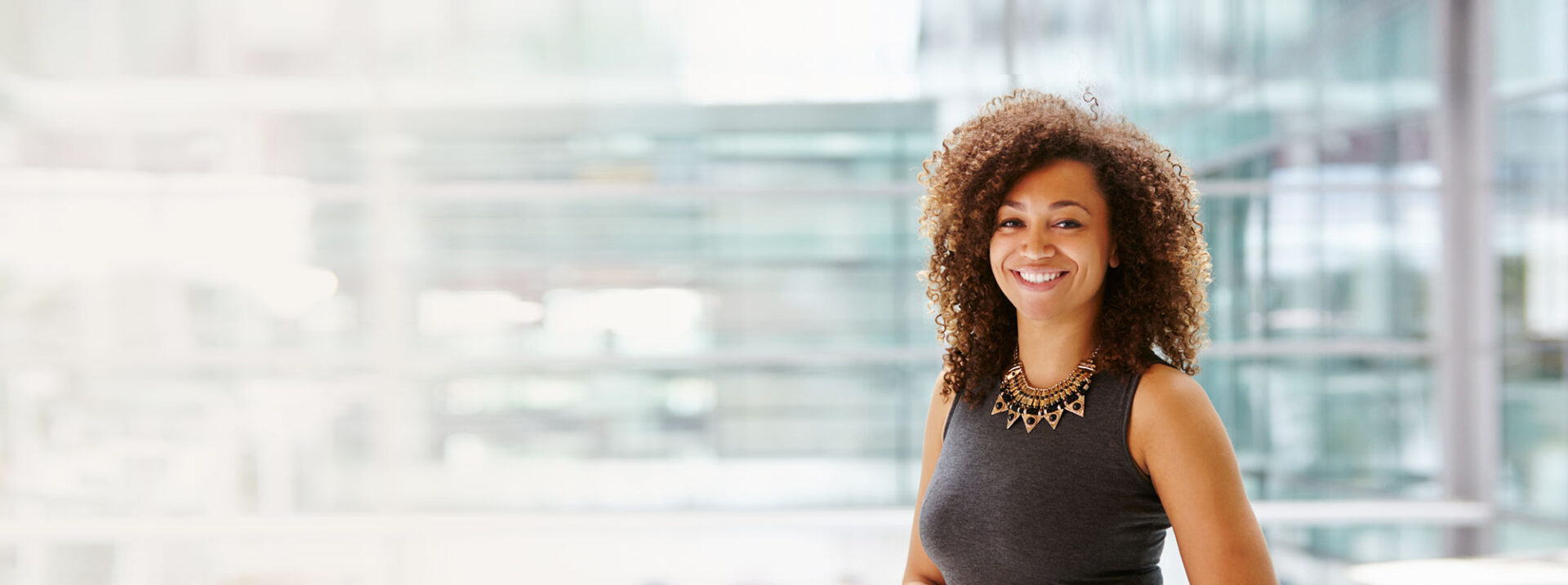 African American businesswoman smiling portrait, waist up